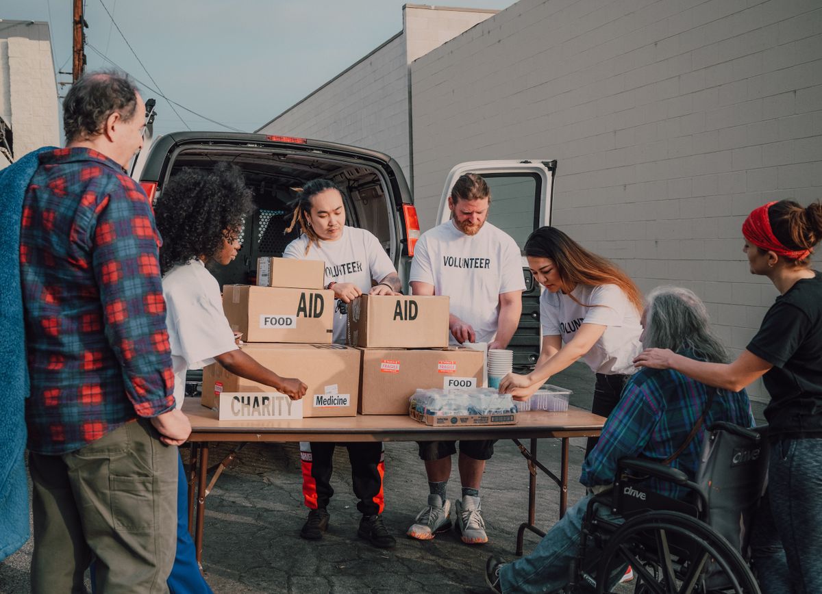 Community volunteers organizing donations and aid together